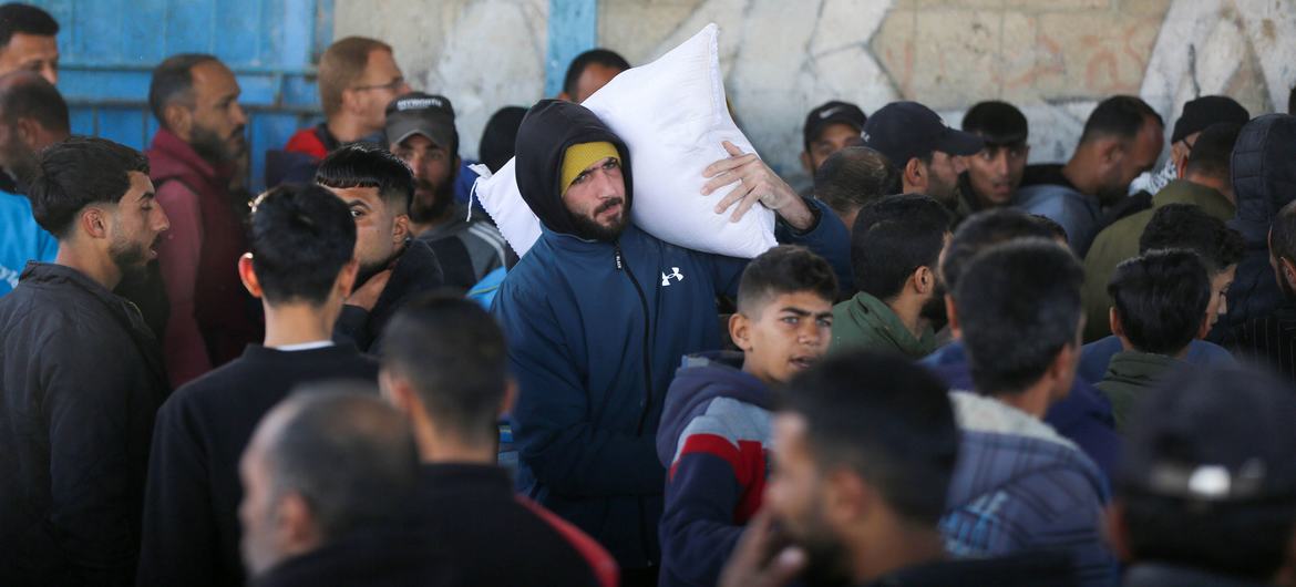 A man carries food aid distributed by the UN in Gaza.