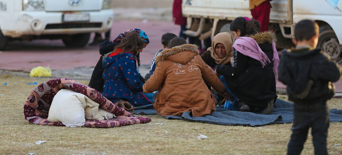 A family gathers at a reception centre in Ar-Raqqa city, Syria.