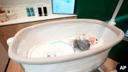 The Bosch Revol Smart Crib is displayed at a Bosch booth during the CES tech show in Las Vegas, Jan. 8, 2025.