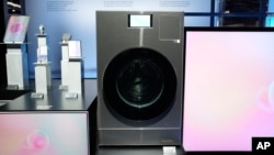 The Samsung Bespoke AI Washing Machine is displayed at a Samsung booth during the CES tech show in Las Vegas, Jan. 8, 2025.