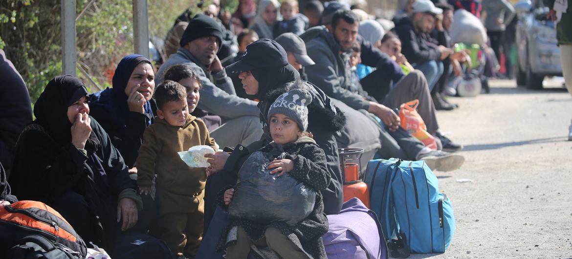 Children and their families wait in Al Nuseirat, in the central Gaza Strip, for the green light to begin their journey back home to Gaza City and the northern areas, after 15 months of displacement.