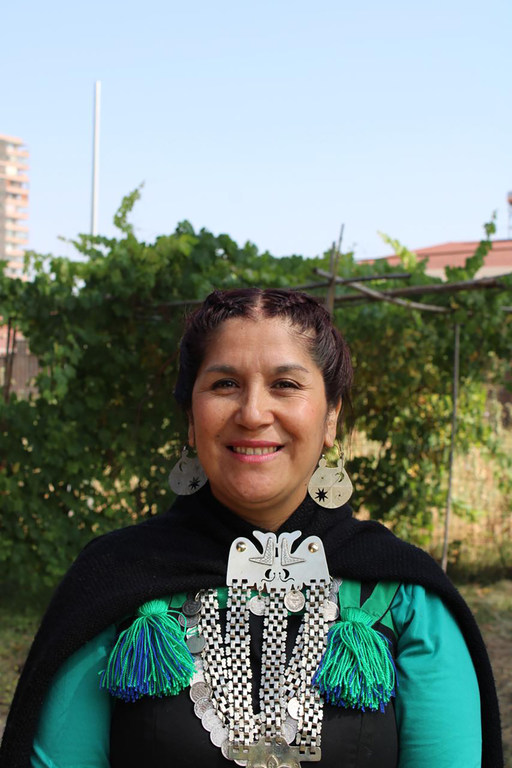 Nevenca Cayullán, a Mapuche educator, wearing traditional clothing and jewellery.