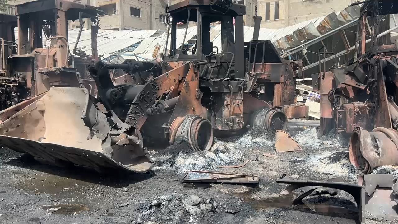 Destroyed heavy equipment, including bulldozers. Destroyed heavy equipment, including bulldozers.