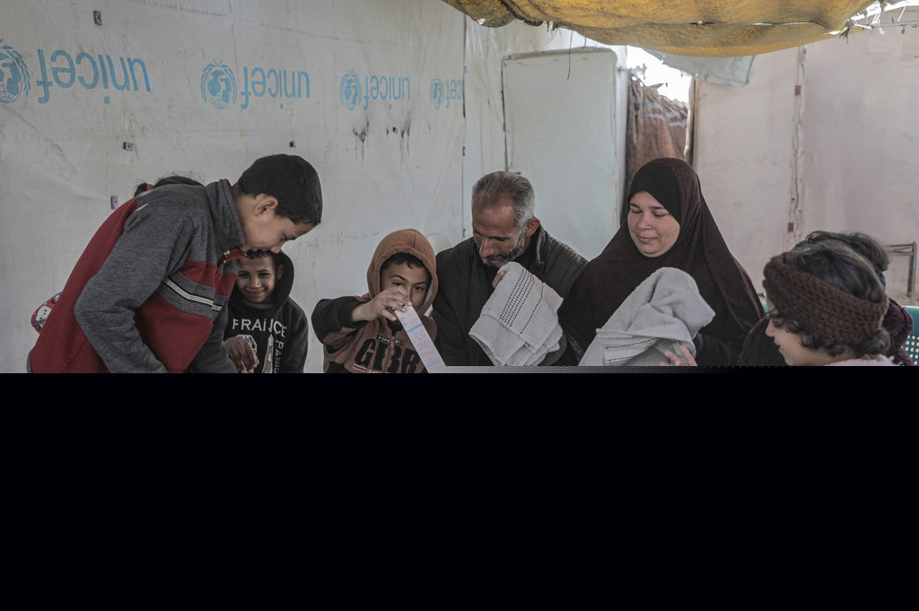 A family in Khan Younis, Gaza, receives hygiene items in January 2025. A family in Khan Younis, Gaza, receives hygiene items in January 2025.