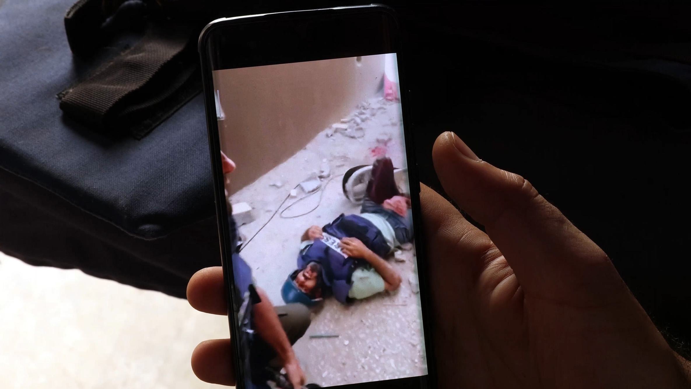 Sami Shehadeh looks at a video of the moment he was injured in Gaza in April 2024. Sami Shehadeh looks at a video of the moment he was injured in Gaza in April 2024.