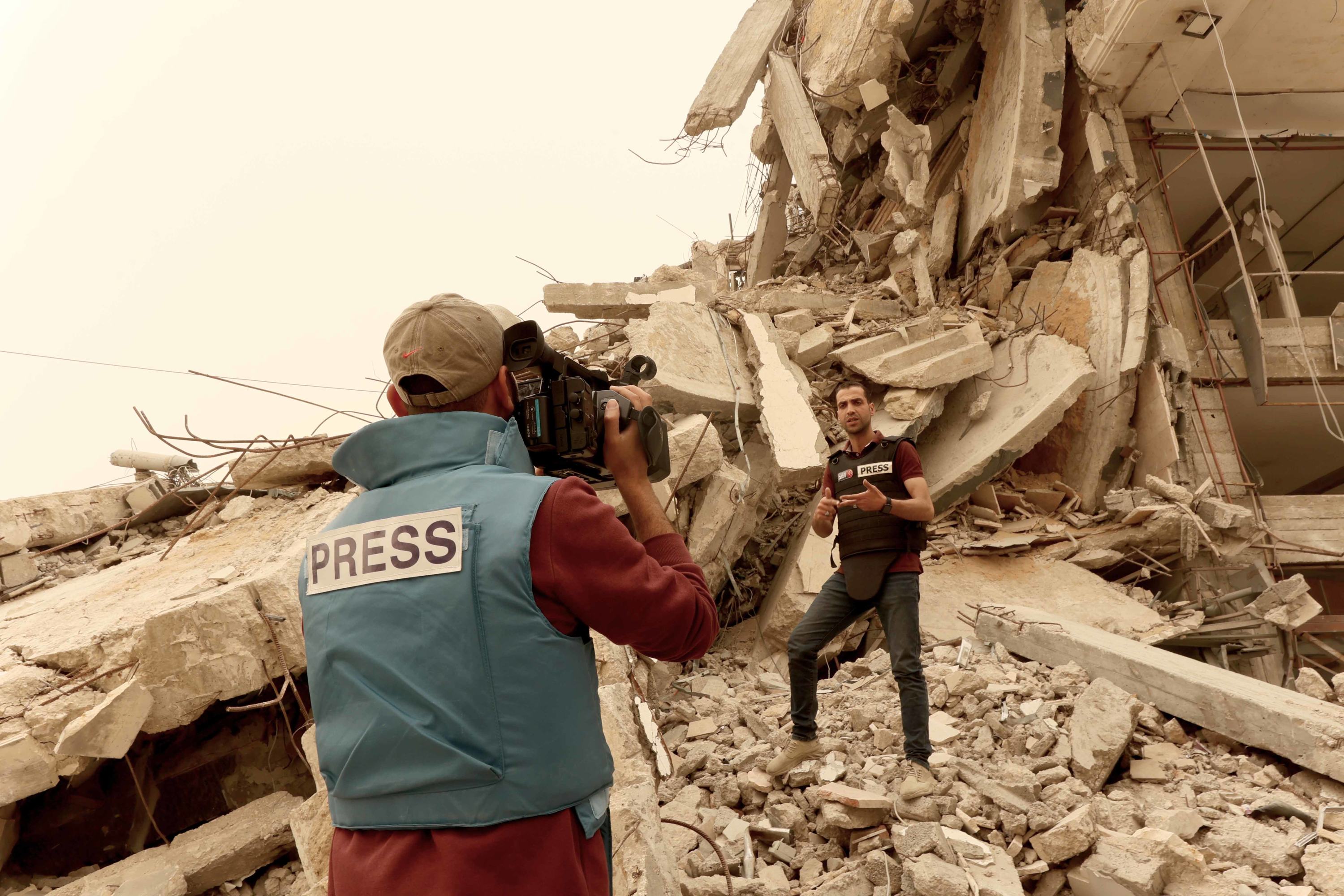 Palestinian journalist Mohammed Abu Namous and his colleague cover the impact of the war in Gaza. Palestinian journalist Mohammed Abu Namous and his colleague cover the impact of the war in Gaza.
