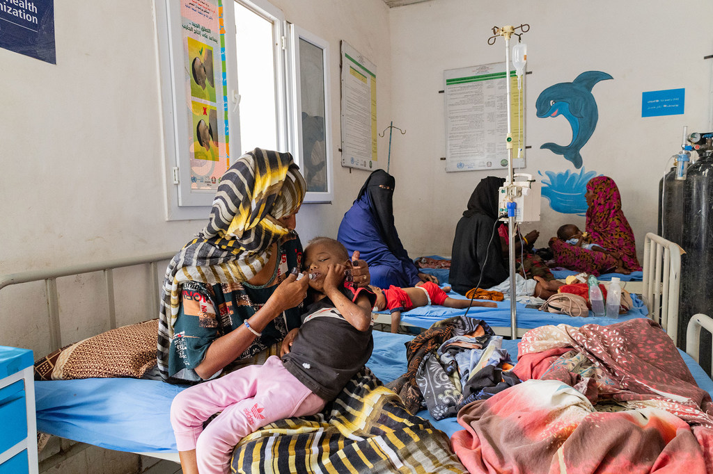 Mothers tend to their children suffering from severe acute malnutrition at a hospital in Port Sudan. Mothers tend to their children suffering from severe acute malnutrition at a hospital in Port Sudan.